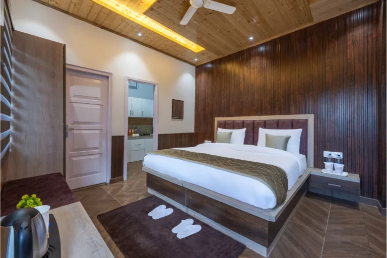Luxurious farm suite room with modern interior, cozy bed, and wooden decor at Farmville, Kasauli.